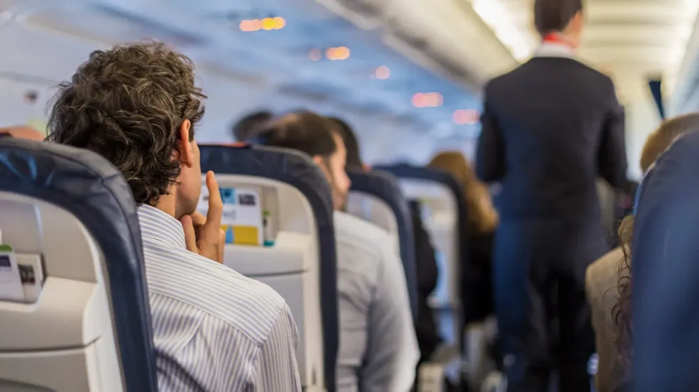 Passengers on the airplane.